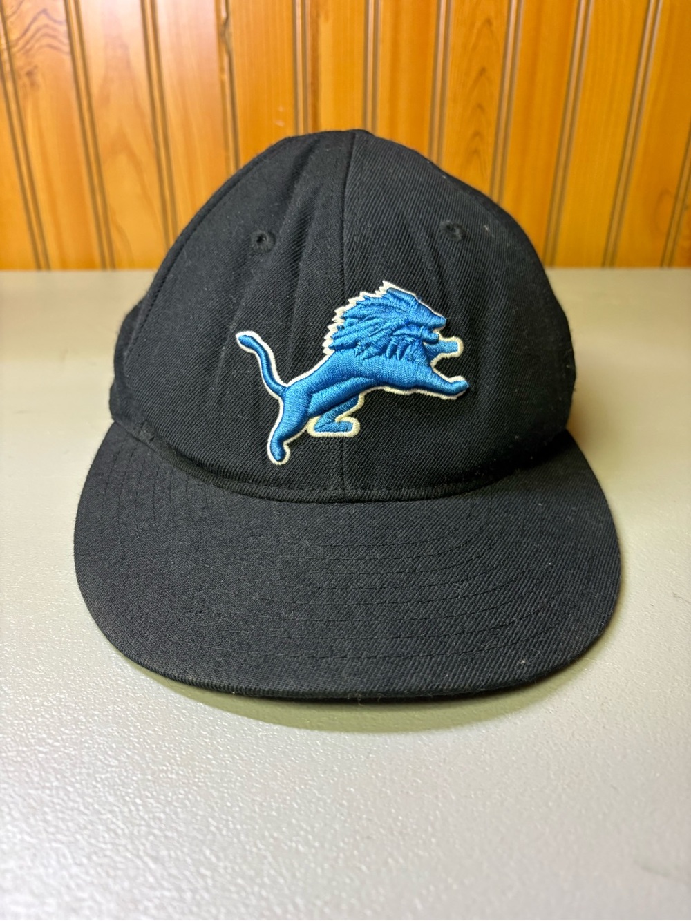 Reebok Black Cap with Blue Lion Patch